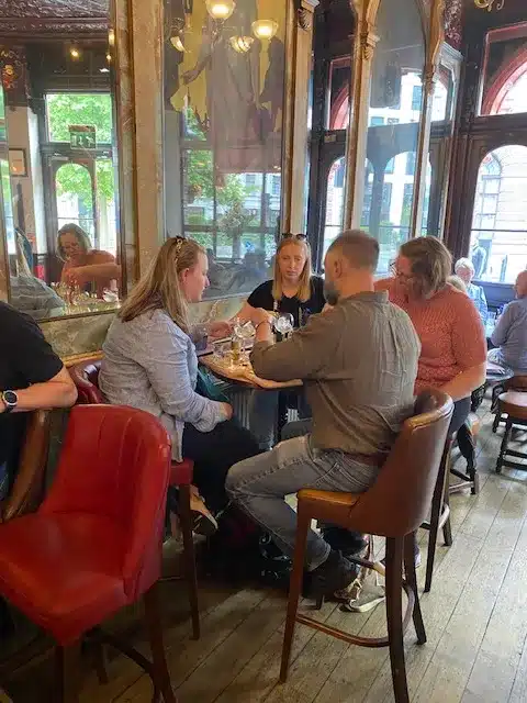 A group of people drinking Gin during their Real London Walks custom Gin tour.